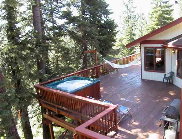 Entertain your guests with private hot tub spa, pool table, 1,000 square feet of beautiful redwood decks, views of Heavenly Ski Area and several mountain ranges, National Forest adjacent to your backyard, wood stove, cable TV, jacuzzi air jet tub, wood paneling and fun open floor plan.