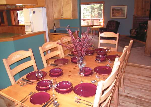 Entertain your guests at this Lake Tahoe vacation rental with 1000 feet of redwood deck, 8 person hot tub, custom built oak pool table, wood stove, views of Heavenly Ski Area and several mountain ranges and surrounded by fir trees.