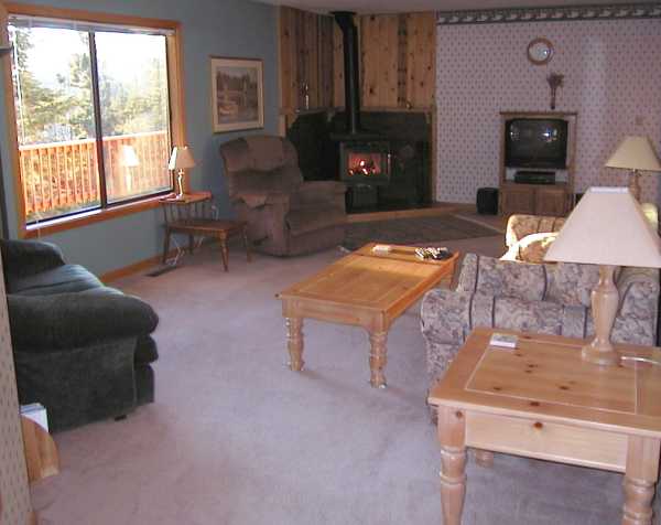 Relax and enjoy a fire as you overlook forested snow-capped mountain ranges and Heavenly Ski Area.