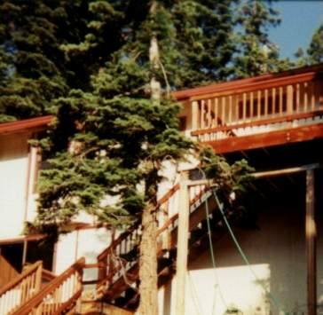 Entertain your guests at this Lake Tahoe vacation rental with 1000 feet of redwood deck, 8 person hot tub, custom built oak pool table, wood stove, views of Heavenly Ski Area and several mountain ranges and surrounded by fir trees.